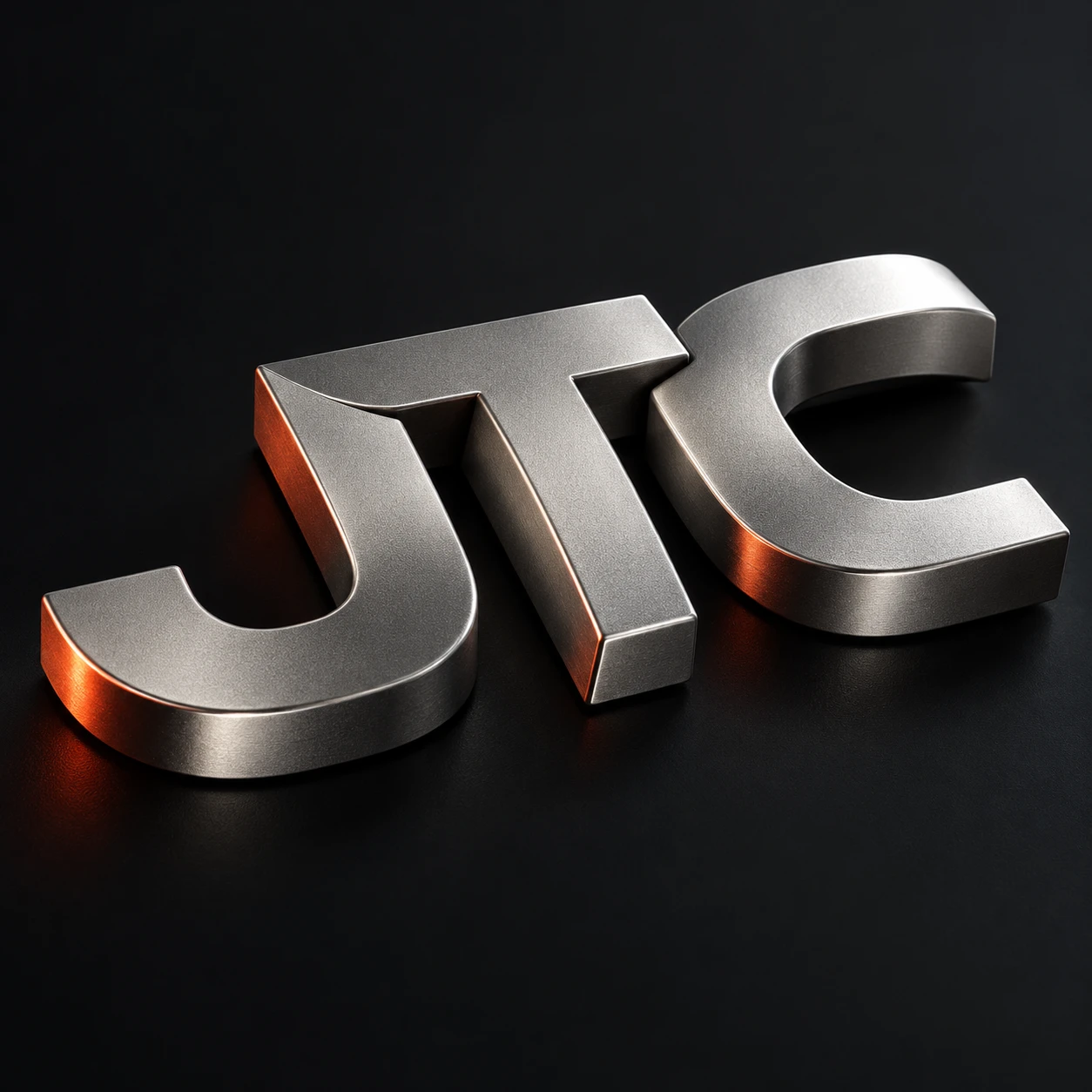 A sculptural JTC monogram in brushed metal